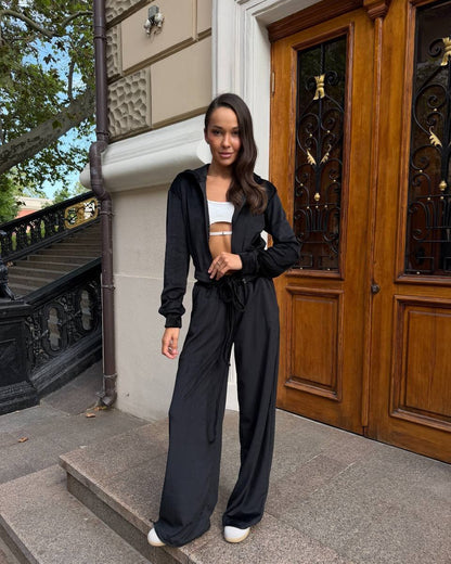 Black velour tracksuit with embroidered trident and wheat wreath, oversized loungewear set, front view