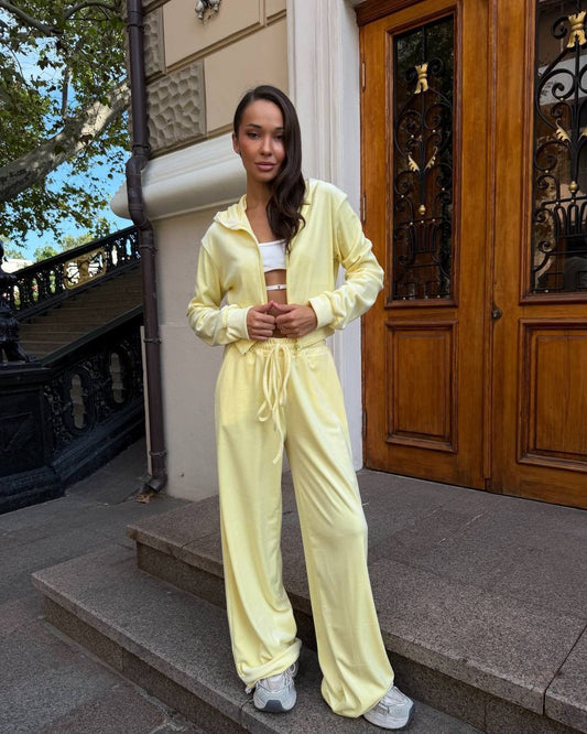 Light yellow velour tracksuit with embroidered trident and wheat wreath, oversized loungewear set, front view