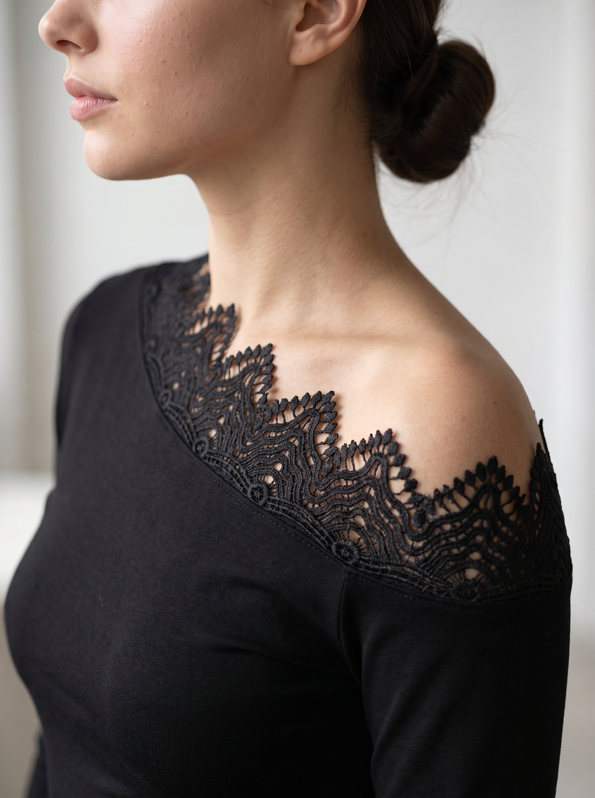 Blouse "Flow" black - asymmetric lace neckline close-up