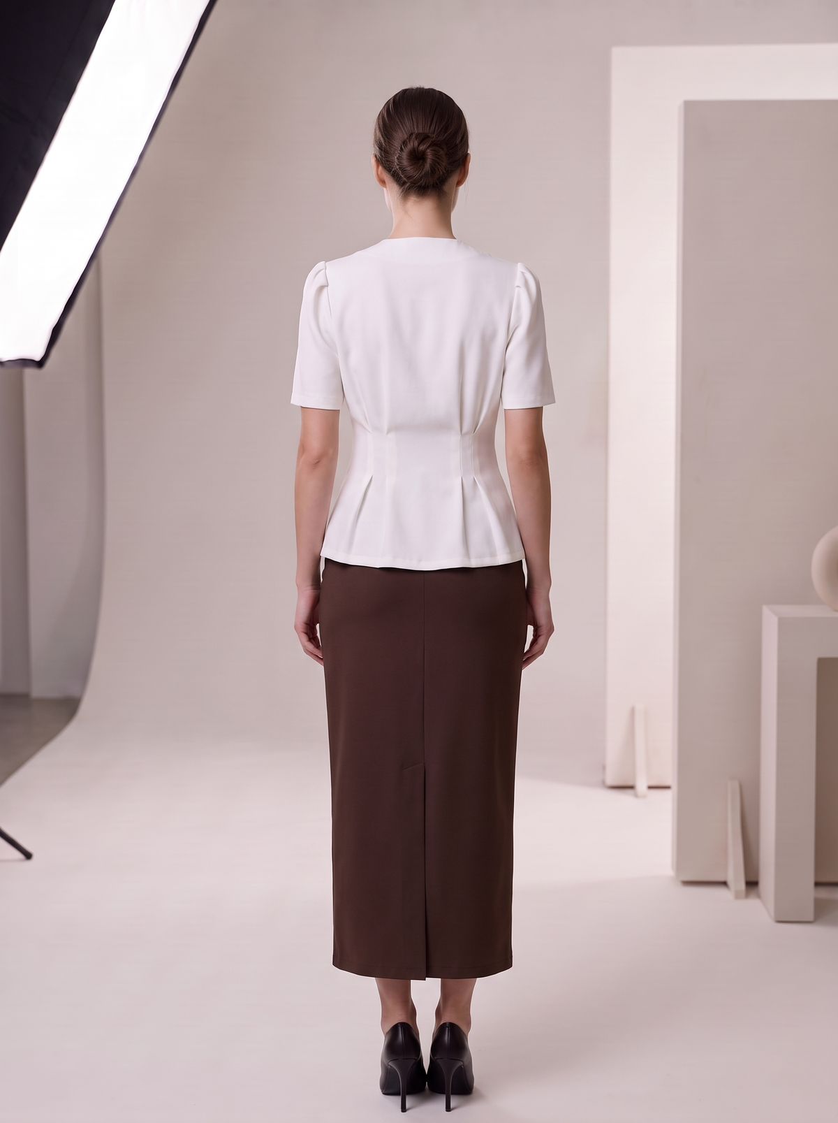 Suit "Jacklin" chocolate - back view, peplum pleats