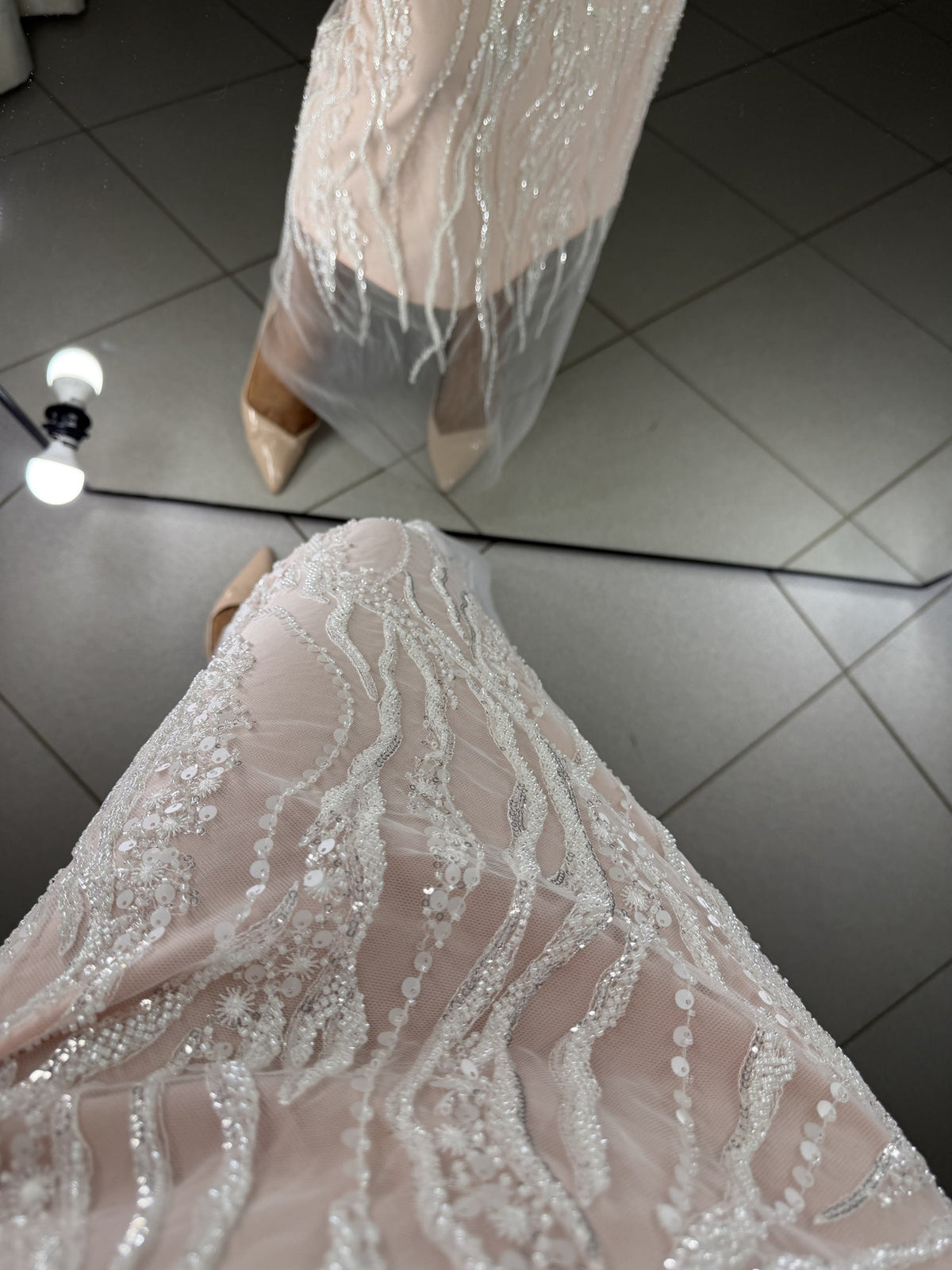 Close-up of Alba guipure with embroidery, sequins and beads on powder lining