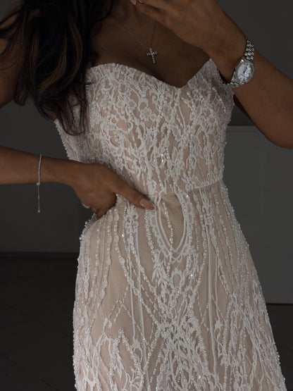 Sweetheart neckline and fitted bodice of white pearl lace dress - close-up