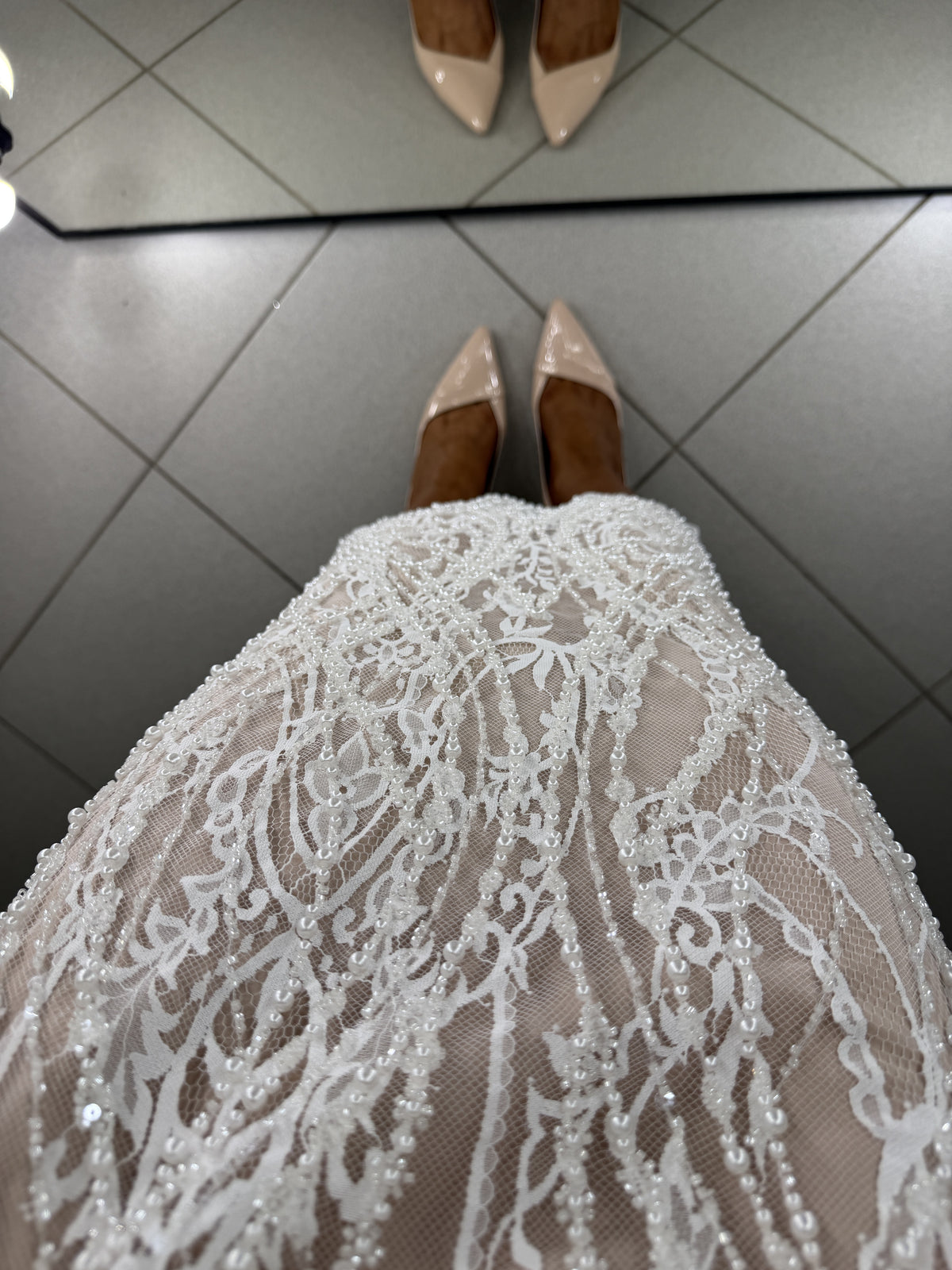 Pearl and bead embroidery on Chantilly lace skirt over nude lining - view from above