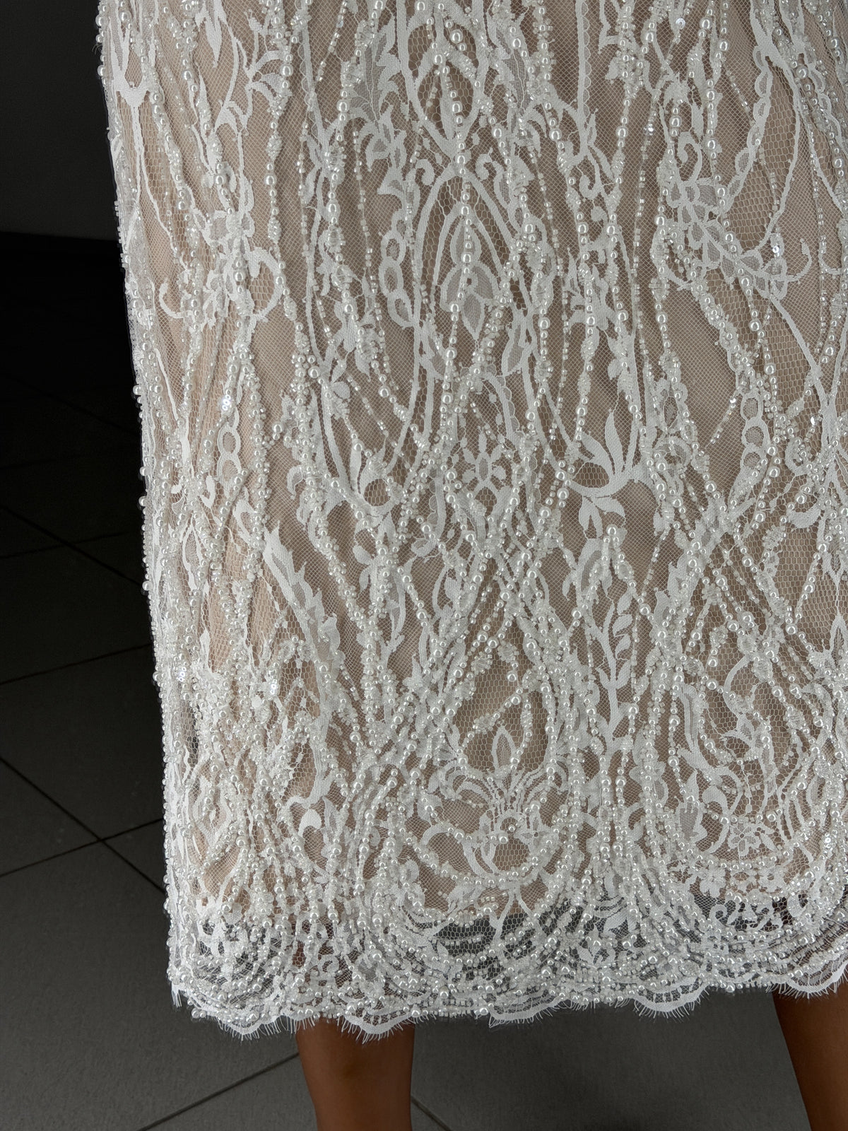 Scalloped Chantilly lace hem with pearls and sequins - fabric close-up
