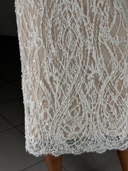 Scalloped Chantilly lace hem with pearls and sequins - fabric close-up