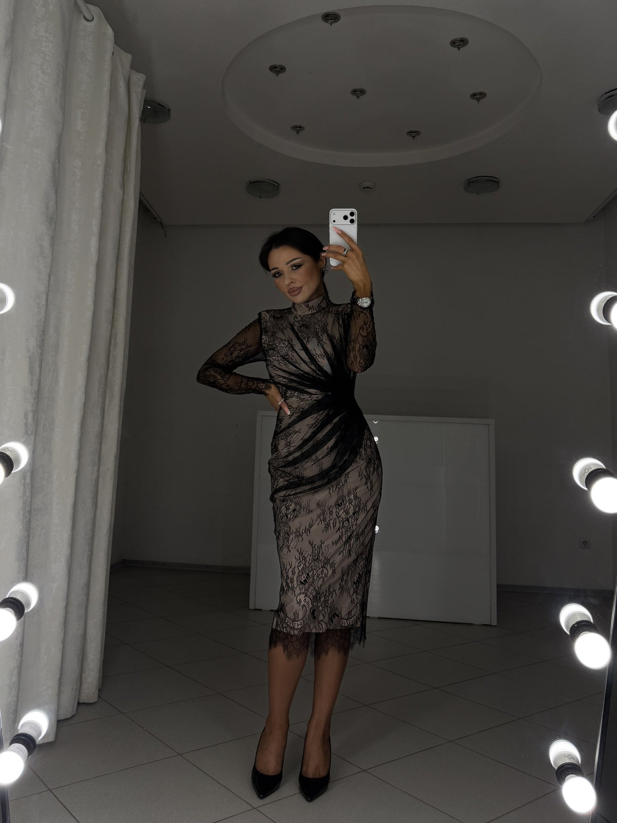Carla black lace dress on beige lining with draped waist - front view