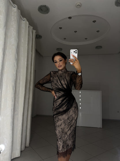 Black lace dress with shoulder pads and long sleeves - waist-up view