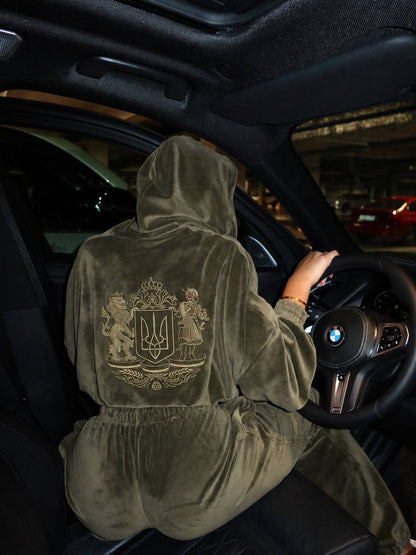Close-up back view of khaki velour tracksuit showing full Ukrainian coat of arms embroidery detail