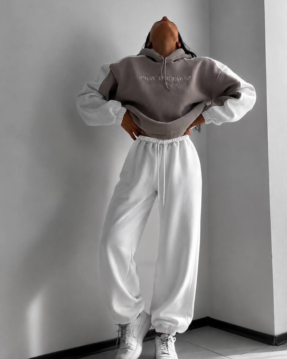 Beige hoodie with milk-white sleeves and wide milk joggers - full-length front view with white sneakers