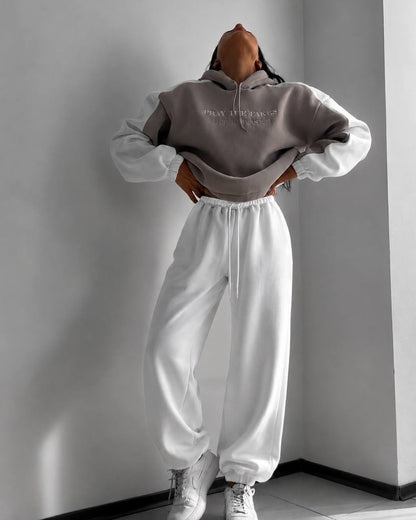 Beige hoodie with milk-white sleeves and wide milk joggers - full-length front view with white sneakers
