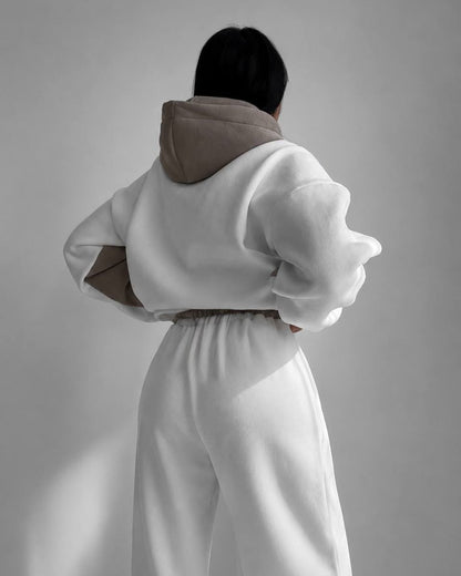 Milk-white tracksuit with a beige hood - back view of the hoodie and wide joggers