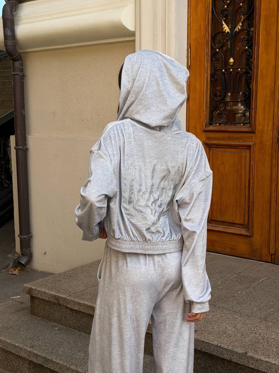 Grey-blue velour tracksuit with embroidered trident and wheat wreath, oversized loungewear set, front view