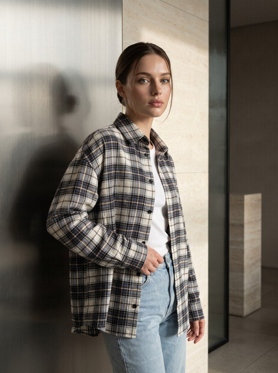 Beige plaid flannel overshirt worn open over a white top with jeans – oversized relaxed-fit shirt for casual everyday layering, front view