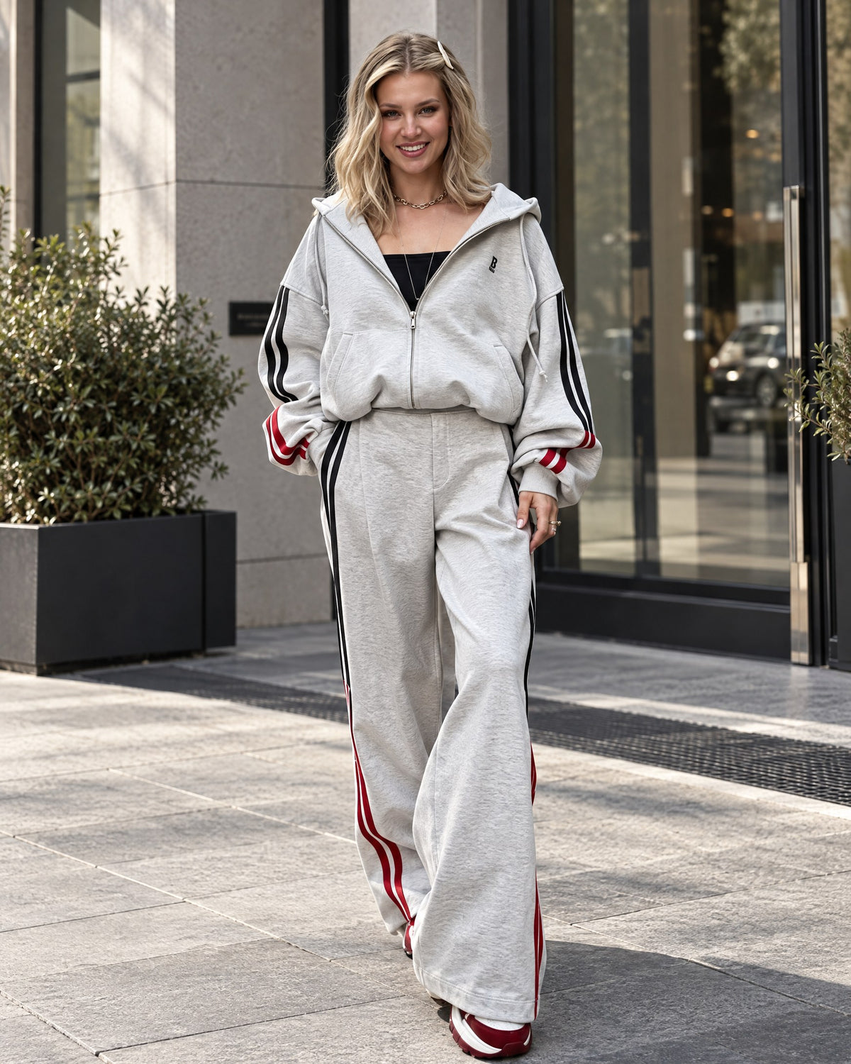 Light gray fleece-lined tracksuit with black and red stripes - front view