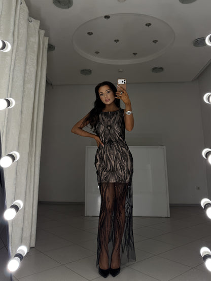 Black beaded evening dress Irma with nude lining - full-length front view, hand on hip