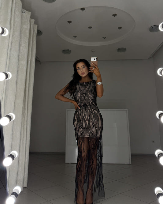 Black beaded evening dress Irma with nude lining - full-length front view, hand on hip