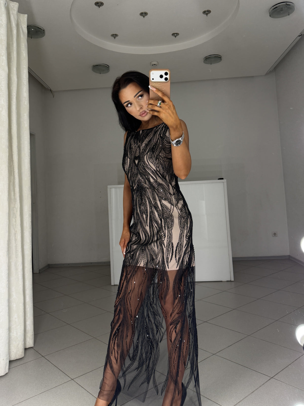Black mesh dress Irma with feather-pattern embroidery - three-quarter view, head tilted