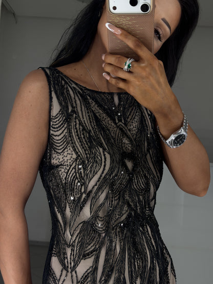 Feather-pattern bead and sequin embroidery on black mesh - close-up of the Irma dress bodice