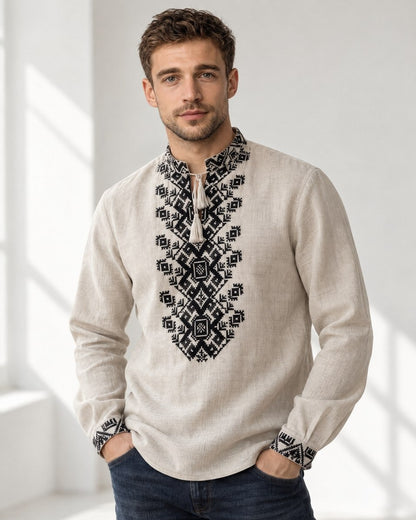 Men's natural linen vyshyvanka with black embroidery, front view, hands in pockets