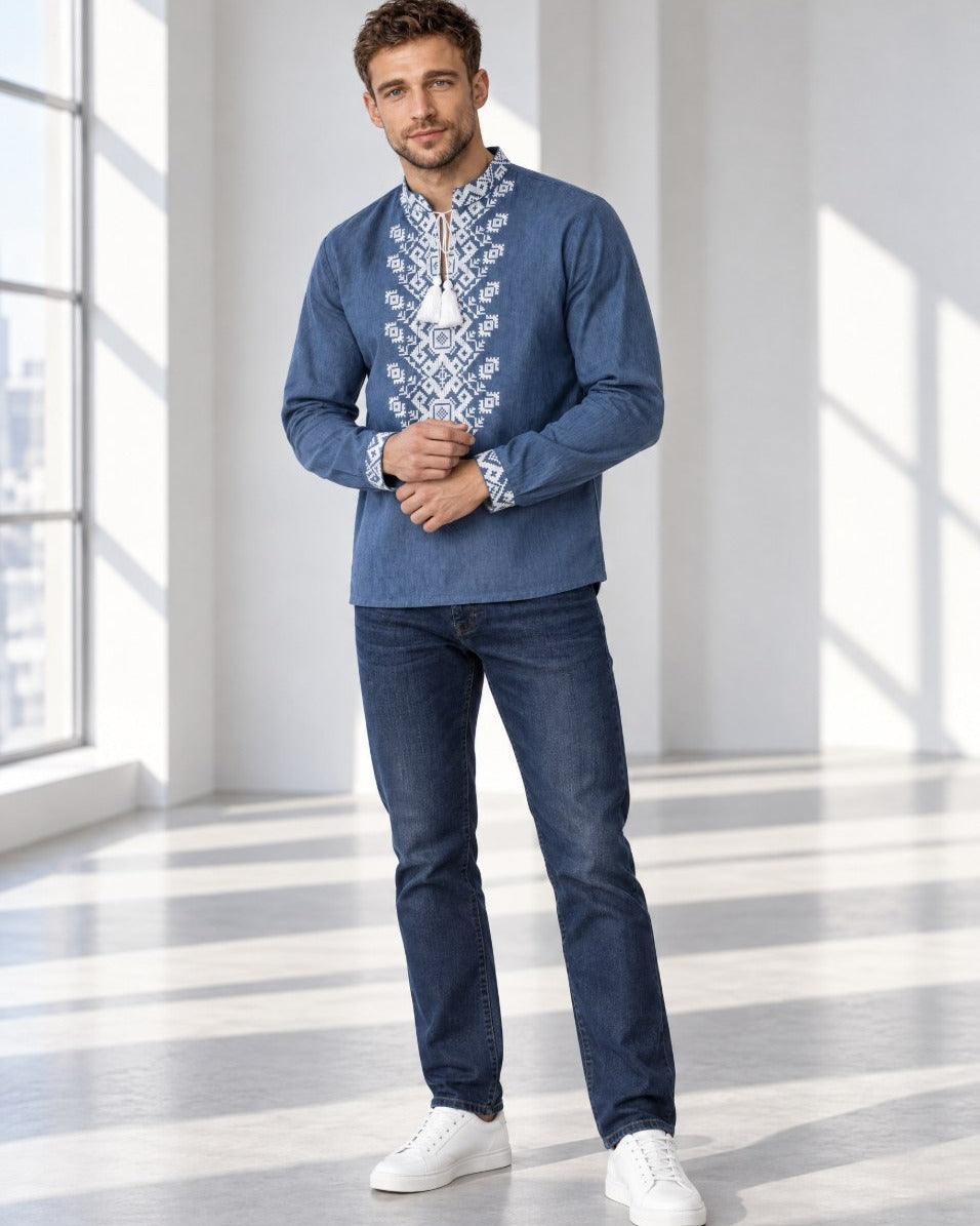 Men's blue linen vyshyvanka worn with dark jeans - full-length view