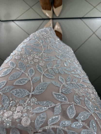 Close-up of Linda dress lace with leaf pattern, beads and sequins
