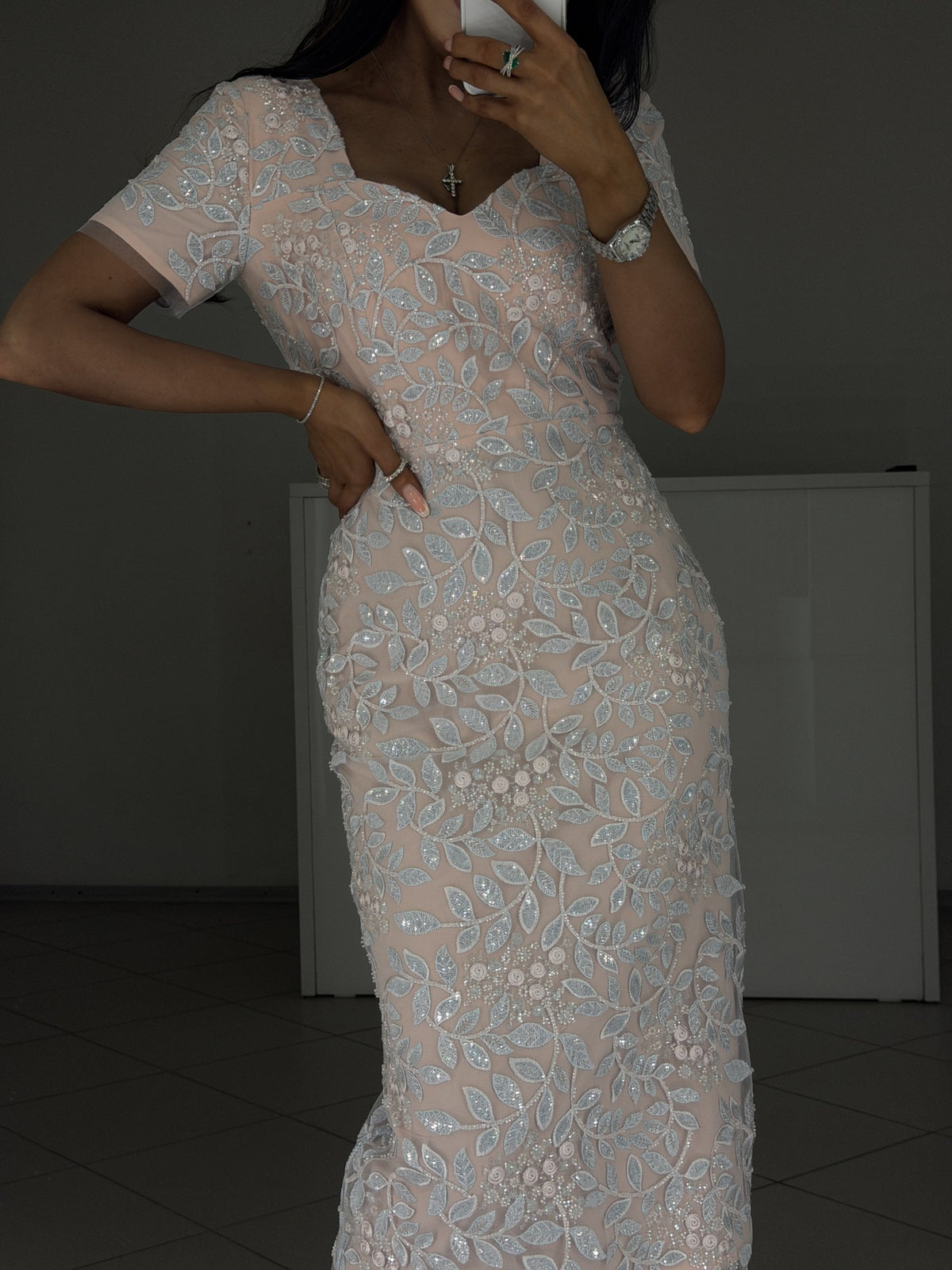Close-up of Linda pink dress fitted waist and hip with embroidered lace