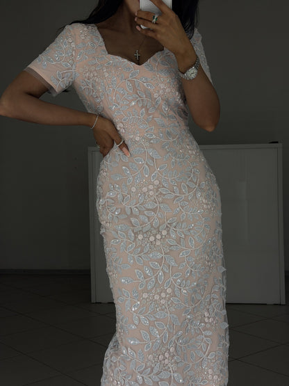 Close-up of Linda pink dress fitted waist and hip with embroidered lace