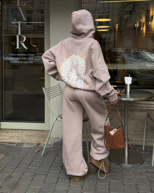Beige women's tracksuit with hoodie and wide trousers, back view with print