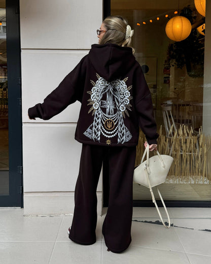 Chocolate brown women's tracksuit with hoodie and wide trousers, back view with print