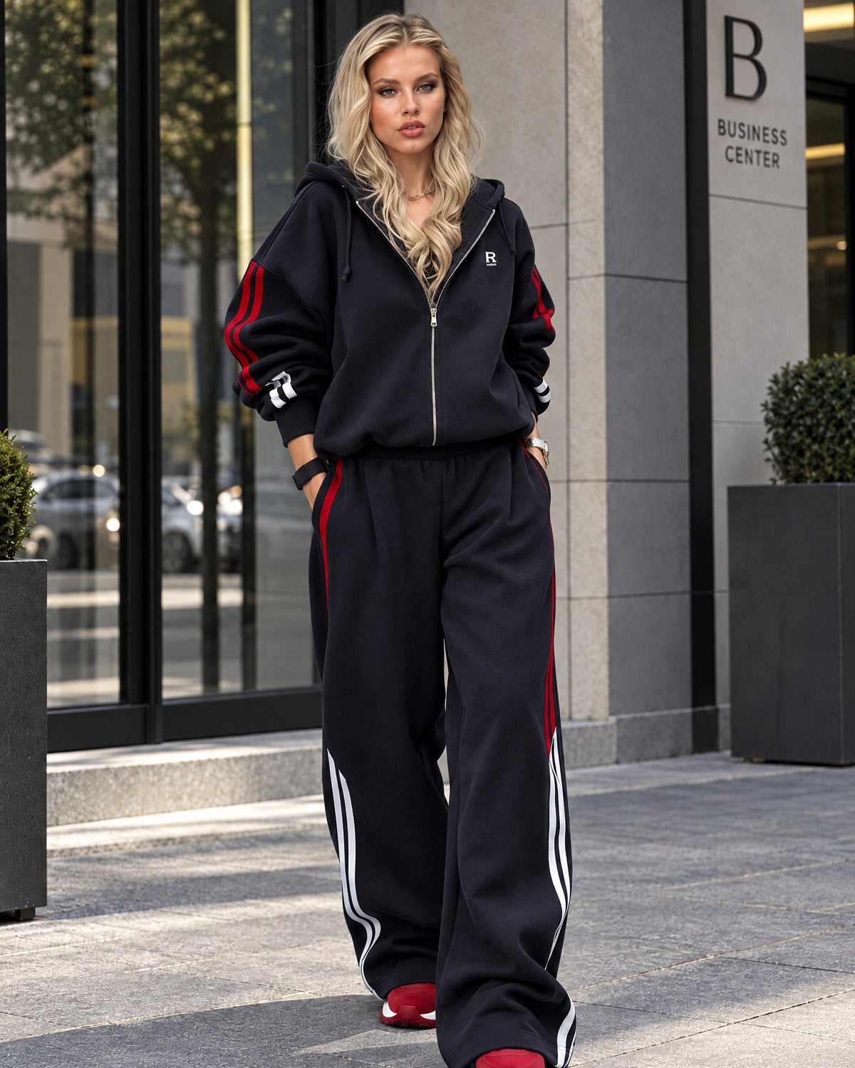 Dark blue women's tracksuit with red and white stripes, ribbed hem hoodie and wide trousers