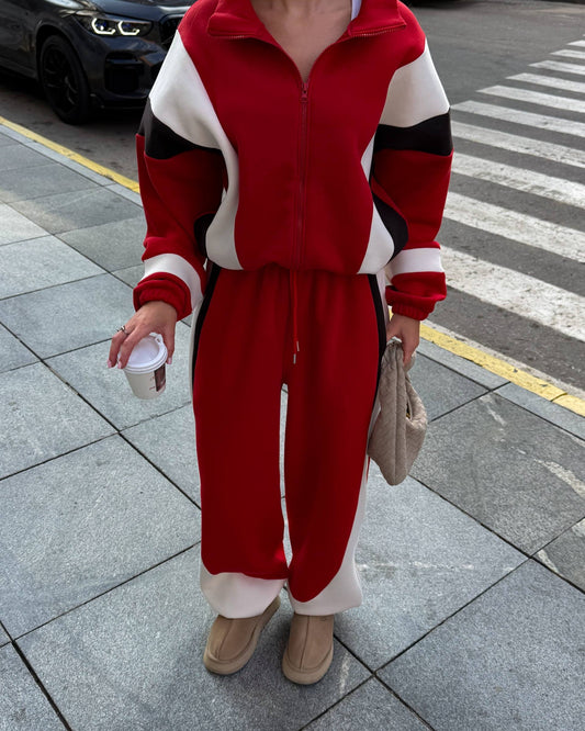 Red colour-block tracksuit with cream and black panels - front view of the zip jacket and wide-leg trousers