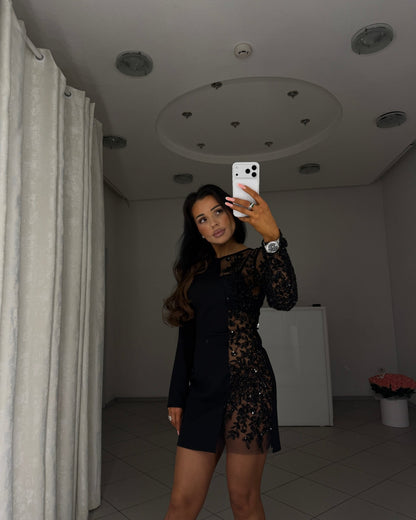 Black asymmetric mini dress with sheer mesh insert, front view