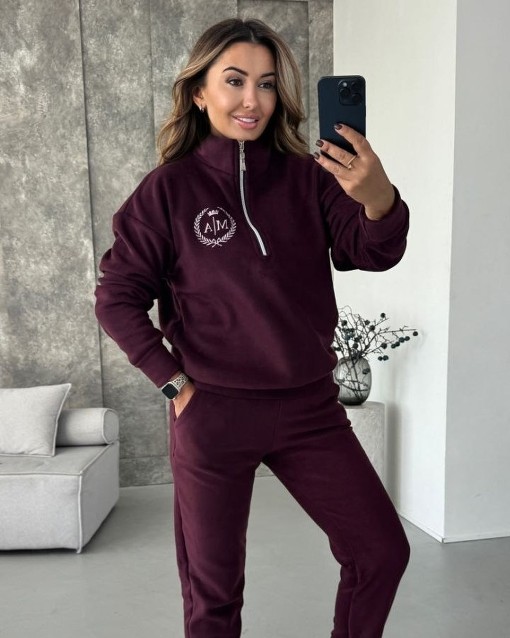 Burgundy women's fleece tracksuit with half-zip sweatshirt and joggers, front view
