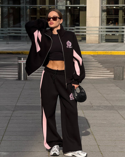 Black tracksuit with pink colour-block panels - full-length front view with the zip jacket worn open and wide-leg trousers
