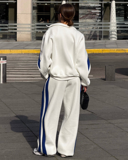 Milk-white tracksuit with blue side stripes - back view of the jacket and wide-leg trousers