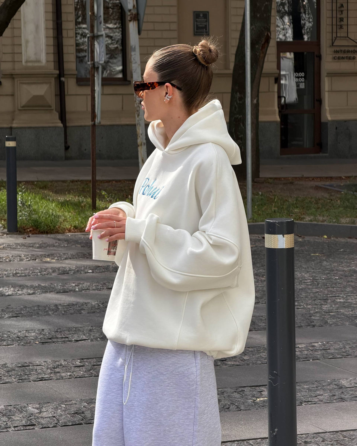 Milk-white oversized hoodie with dropped shoulders and ribbed cuffs - side view