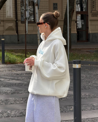 Milk-white oversized hoodie with dropped shoulders and ribbed cuffs - side view