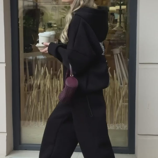 Black tracksuit with hoodie and wide trousers, video