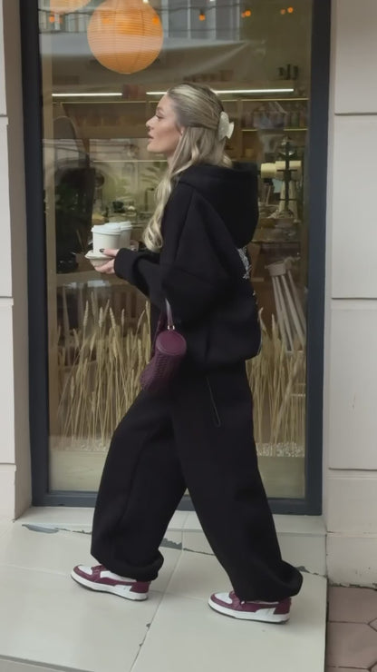 Black tracksuit with hoodie and wide trousers, video
