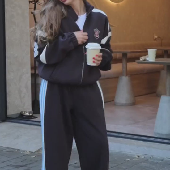 Black tracksuit with red and blue stripes - video
