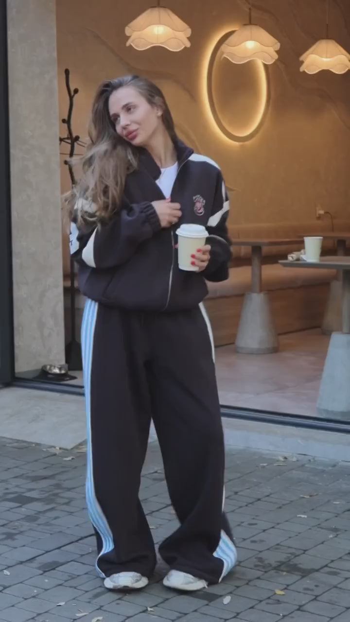 Black tracksuit with red and blue stripes - video