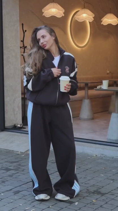 Black tracksuit with red and blue stripes - video
