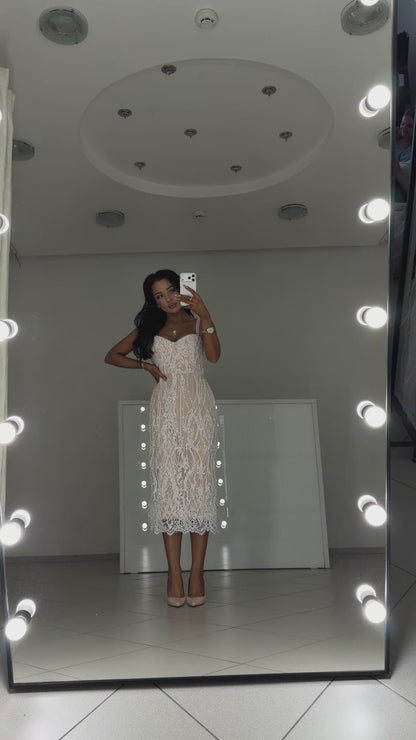 Video of white pearl Chantilly lace midi dress Arabella - model shows the dress in motion and lace details