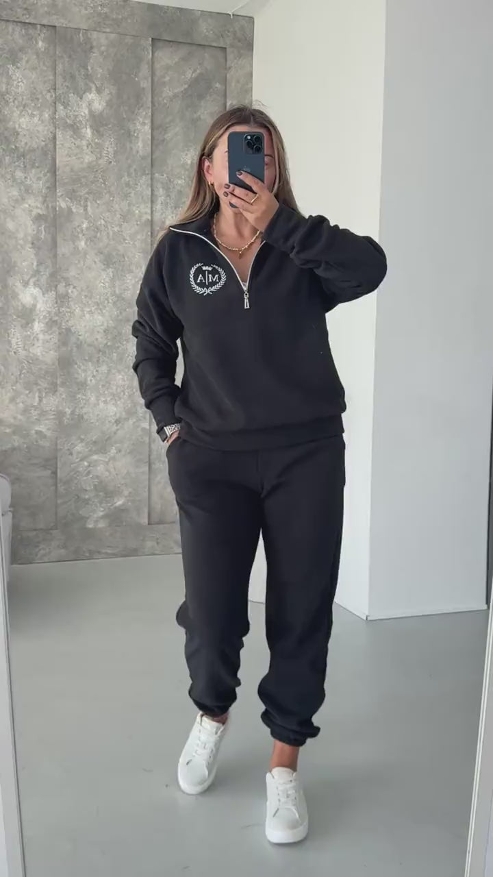 Black fleece tracksuit with half-zip sweatshirt and joggers, video