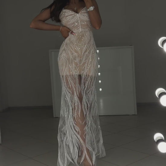 Video of white beaded guipure evening dress Royal - model shows the dress from the front in motion