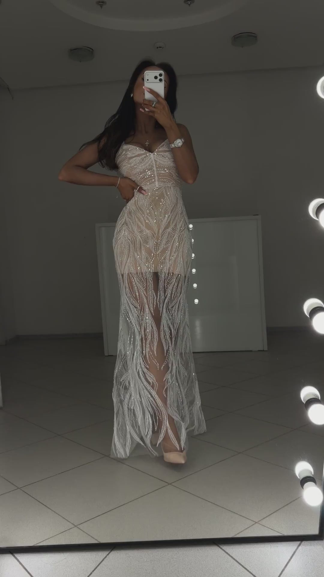 Video of white beaded guipure evening dress Royal - model shows the dress from the front in motion