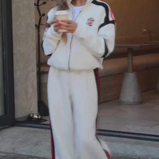 Milk white tracksuit with black and red stripes - video