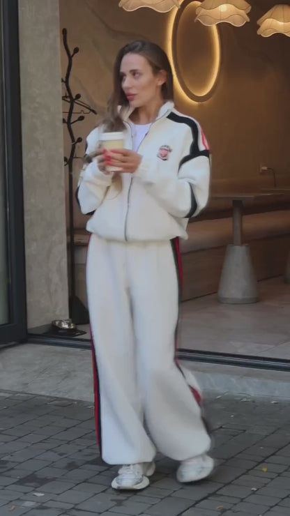 Milk white tracksuit with black and red stripes - video