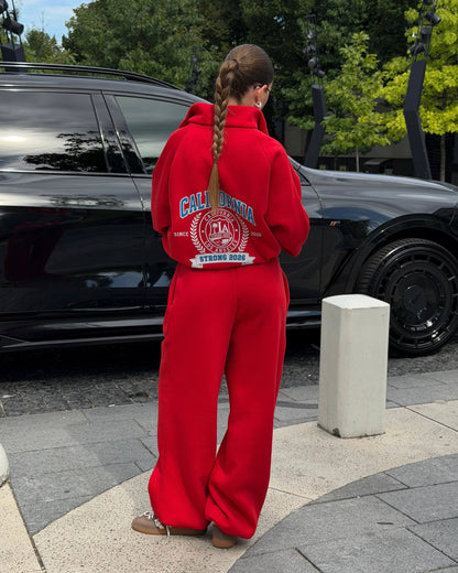 Red oversized tracksuit - back view with large crest print and wide-leg trousers