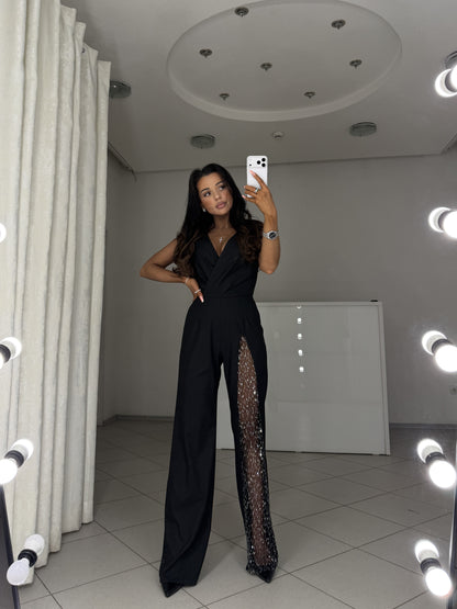 Black tailored jumpsuit Solmira, wrap V-neckline - hand on hip pose